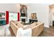 Cozy living room with high ceilings, a fireplace, and a large sectional sofa at 561 Farnham Dr, Westfield, IN 46074