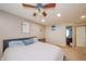 Spacious bedroom with a ceiling fan, carpet flooring, and natural light, providing a comfortable retreat at 610 E 1000 N, Fortville, IN 46040