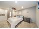 Cozy bedroom with a ceiling fan, carpet flooring, and neutral tones, creating a peaceful and inviting atmosphere at 610 E 1000 N, Fortville, IN 46040
