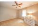 Simple bedroom with dresser, ceiling fan and window light at 610 E 1000 N, Fortville, IN 46040