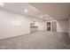 Finished basement area featuring neutral carpet and a bar with decorative wood accents at 6471 W Clearview Dr, McCordsville, IN 46055