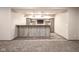 Basement bar area with custom wood paneling, inset lighting, and open shelving at 6471 W Clearview Dr, McCordsville, IN 46055