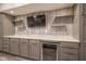 Close up of a basement bar featuring custom cabinets, a mini-fridge, and granite countertop at 6471 W Clearview Dr, McCordsville, IN 46055