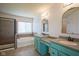 A full bathroom with dual sinks, granite counters, and a tub shower combo at 6471 W Clearview Dr, McCordsville, IN 46055