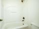 Clean, bright bathroom featuring a shower-tub combo with white acrylic surround at 6471 W Clearview Dr, McCordsville, IN 46055