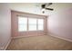 Bedroom with neutral carpet, ceiling fan, and a large window at 6471 W Clearview Dr, McCordsville, IN 46055
