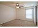 This bedroom has neutral carpet, a ceiling fan, and a window at 6471 W Clearview Dr, McCordsville, IN 46055