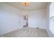 Cozy carpeted bedroom with a door leading to an adjacent room and a window with blinds at 6471 W Clearview Dr, McCordsville, IN 46055