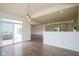View of Dining Area with backyard views next to green Kitchen with stainless appliances and island at 6471 W Clearview Dr, McCordsville, IN 46055