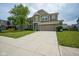 Charming two-story home with a lush lawn and a convenient two-car garage at 6471 W Clearview Dr, McCordsville, IN 46055