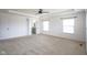 Spacious main bedroom with carpet, neutral walls, ceiling fan and view of bathroom at 6471 W Clearview Dr, McCordsville, IN 46055
