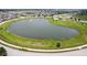 An aerial view shows a beautiful pond and surrounding neighborhood in a well-planned community at 6471 W Clearview Dr, McCordsville, IN 46055