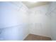 Walk-in closet featuring white walls, carpeted floors, and wire shelving at 6471 W Clearview Dr, McCordsville, IN 46055