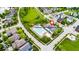 Beautiful aerial view of the neighborhood clubhouse with a swimming pool and well-manicured landscaping at 6691 Beekman Pl, Zionsville, IN 46077