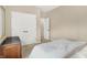 Bedroom featuring neutral walls, plush carpet, and a double-door closet for storage at 6691 Beekman Pl, Zionsville, IN 46077