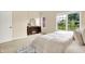 Bright bedroom featuring neutral walls, plush carpet, and a dresser near the window at 6691 Beekman Pl, Zionsville, IN 46077