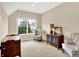 Cozy bedroom with neutral walls, plush carpet, a window, and two chairs near the wall at 6691 Beekman Pl, Zionsville, IN 46077