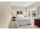 Comfortable bedroom with neutral paint, plush carpet, and a window providing natural light at 6691 Beekman Pl, Zionsville, IN 46077
