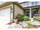 Inviting home exterior with beautiful landscaping, stone walkway and lush garden at 6691 Beekman Pl, Zionsville, IN 46077