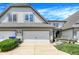 Charming home featuring a three car garage, manicured shrubs, and a beautiful front yard at 6691 Beekman Pl, Zionsville, IN 46077