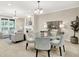 Combined living and dining area with neutral decor, offering a view of the fireplace at 6691 Beekman Pl, Zionsville, IN 46077
