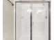 Enclosed shower with glass doors showcasing the clean, bright space in the bathroom at 6691 Beekman Pl, Zionsville, IN 46077