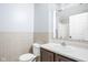 Bathroom features a ceramic tile floor, sink and toilet with a white tub and shower combo at 6955 Long Run Dr, Indianapolis, IN 46268