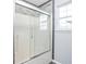 Updated bathroom features a modern shower with glass doors and tiled surround at 6955 Long Run Dr, Indianapolis, IN 46268