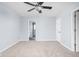 Bedroom featuring neutral paint, carpet, a ceiling fan and two closets at 6955 Long Run Dr, Indianapolis, IN 46268