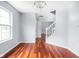 Inviting dining space with hardwood floors and view to the staircase at 6955 Long Run Dr, Indianapolis, IN 46268