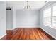Dining area with hardwood floors, neutral walls, and a classic chandelier at 6955 Long Run Dr, Indianapolis, IN 46268