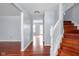 Open foyer area with hardwood floors, staircase, and neutral paint at 6955 Long Run Dr, Indianapolis, IN 46268