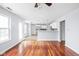 Open living room featuring hardwood floors, lots of natural light and an open access to the kitchen at 6955 Long Run Dr, Indianapolis, IN 46268