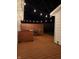 Cozy back deck with string lights, featuring a privacy fence and a dining set for outdoor entertaining at 717 Berkeley Dr, Shelbyville, IN 46176