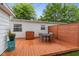 Cozy backyard with string lights over a wooden deck, and patio seating at 717 Berkeley Dr, Shelbyville, IN 46176