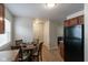 Kitchen with wood cabinets, modern appliances, and a view into the living area at 717 Berkeley Dr, Shelbyville, IN 46176