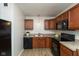Well-lit kitchen with wood cabinets, modern appliances, and a clean design at 717 Berkeley Dr, Shelbyville, IN 46176
