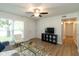 Bright living room featuring hardwood floors, a ceiling fan, and contemporary decor at 717 Berkeley Dr, Shelbyville, IN 46176