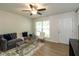 Inviting living room with hardwood floors, modern furniture, and ample natural light at 717 Berkeley Dr, Shelbyville, IN 46176