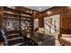 Luxurious home office featuring custom bookshelves and refined seating for a comfortable workspace at 7341 Washington Blvd, Indianapolis, IN 46240