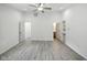 Bedroom features gray wood floors, three doors, white trim and walls, and recessed lighting at 7434 N Green Meadows, Fairland, IN 46126