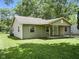 A cozy home featuring a covered porch with wooden columns and neutral vinyl siding at 7434 N Green Meadows, Fairland, IN 46126