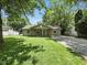 Charming single-story home with a well-maintained lawn, mature trees, and a gravel driveway at 7434 N Green Meadows, Fairland, IN 46126