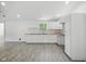 Kitchen with white cabinets, butcher block countertops, recessed lighting, and gray wood floors at 7434 N Green Meadows, Fairland, IN 46126
