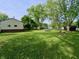Expansive backyard with lush greenery, offering plenty of space for outdoor activities and relaxation at 771 Doran Ave, Shelbyville, IN 46176