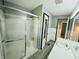 Bathroom features a shower and vanity, all well-lit at 771 Doran Ave, Shelbyville, IN 46176