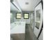 Bathroom features a vanity, toilet, and shower, all well-lit at 771 Doran Ave, Shelbyville, IN 46176