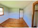 Comfortable bedroom with wood floors and a closet at 771 Doran Ave, Shelbyville, IN 46176