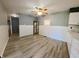 Dining area with wood-look floors, neutral walls, and a ceiling fan at 771 Doran Ave, Shelbyville, IN 46176