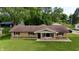 Charming brick home with a well-manicured front lawn, showcasing curb appeal at 771 Doran Ave, Shelbyville, IN 46176